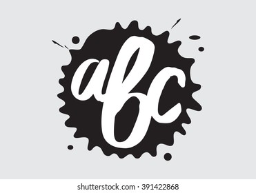 A drop of black ink, white painted by brush, letters. White background with black blot, white letters