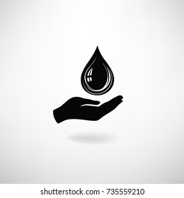 Drop icon in hand silhouette. Save water symbol