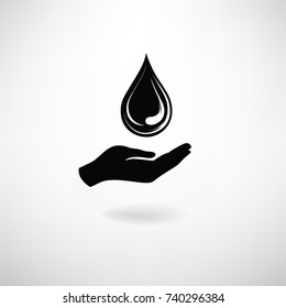 Drop icon in hand silhouette. Save clean water symbol