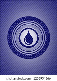 drop icon inside badge with denim background