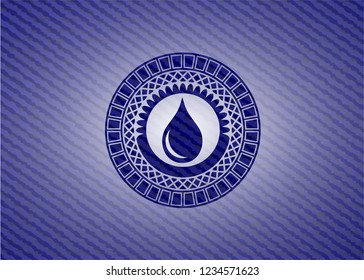 drop icon inside badge with denim background