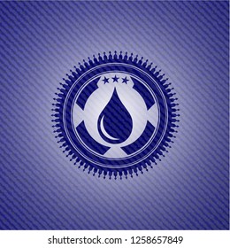drop icon inside badge with denim background