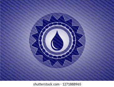 drop icon inside badge with denim background