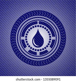 drop icon inside badge with denim background