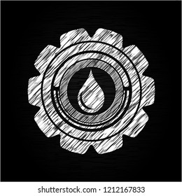 drop icon inside chalk emblem written on a blackboard
