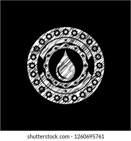 drop icon inside chalkboard emblem on black board