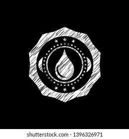 drop icon inside chalkboard emblem on black board