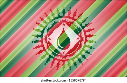 drop icon inside christmas badge background.