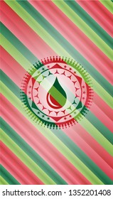 drop icon inside christmas colors style emblem.