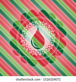 drop icon inside christmas colors style emblem.