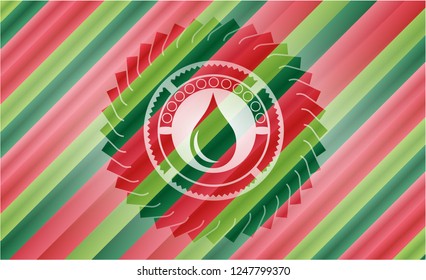 drop icon inside christmas emblem.