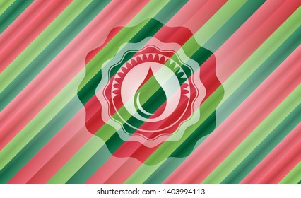 drop icon inside christmas emblem.