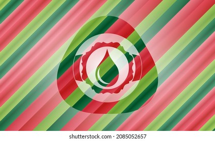 drop icon inside christmas emblem. 