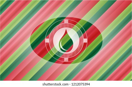 drop icon inside christmas style emblem.
