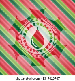 drop icon inside christmas style emblem.