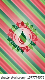 drop icon inside christmas style emblem.
