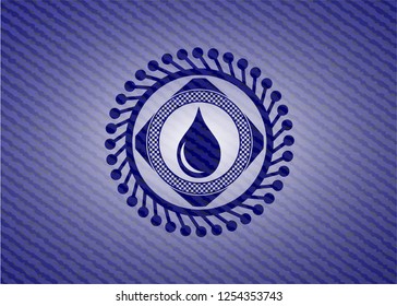 drop icon inside emblem with jean high quality background