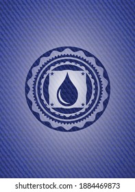 drop icon inside emblem with jean high quality background. 