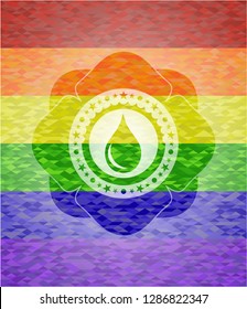 drop icon inside emblem on mosaic background with the colors of the LGBT flag