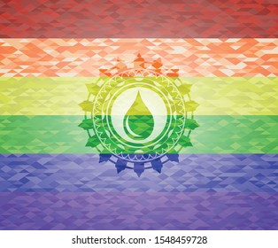 drop icon inside emblem on mosaic background with the colors of the LGBT flag