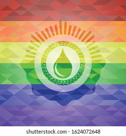 drop icon inside emblem on mosaic background with the colors of the LGBT flag