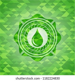 drop icon inside green emblem with mosaic background
