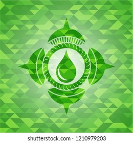 drop icon inside green emblem. Mosaic background