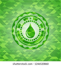 drop icon inside green emblem with triangle mosaic background
