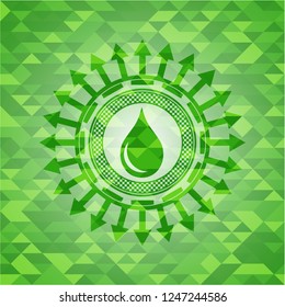 drop icon inside green emblem with mosaic background