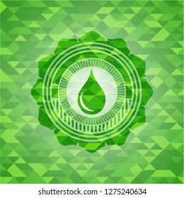 drop icon inside green emblem with triangle mosaic background