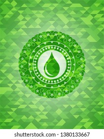 drop icon inside green emblem with mosaic ecological style background