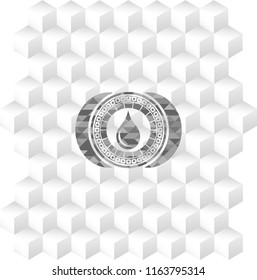 drop icon inside grey emblem with geometric cube white background