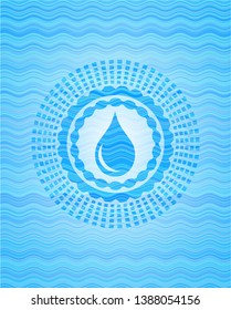 drop icon inside light blue water wave style emblem.