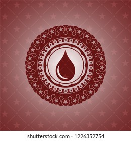 drop icon inside red emblem