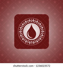 drop icon inside red emblem