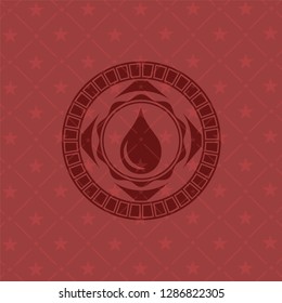 drop icon inside retro style red emblem