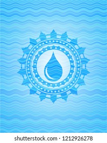 drop icon inside sky blue water emblem.