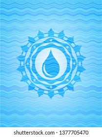 drop icon inside sky blue water badge background.