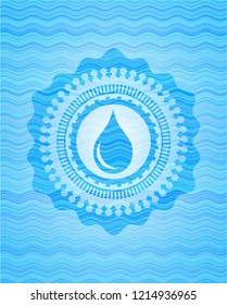 drop icon inside water wave representation style emblem.
