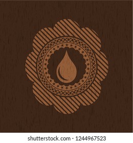 drop icon inside wooden emblem. Retro