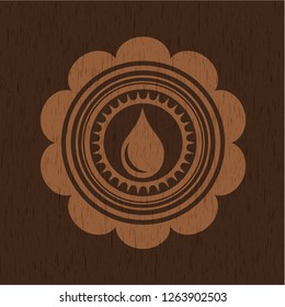 drop icon inside wooden emblem. Vintage.
