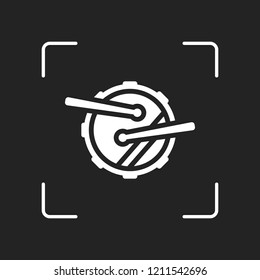 Drum icon. Simple music instrument with drumsticks. White object in camera autofocus on dark background