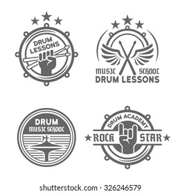 Drum school or drum lessons set of four vector vintage monochrome labels, badges, emblems isolated on white background