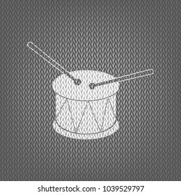 Drum sign. Vector. White knitted icon on gray knitted background. Isolated.