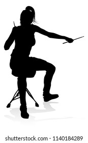 A drummer musician drumming drums in detailed silhouette