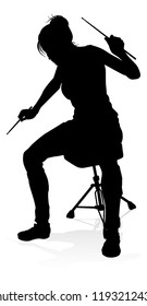 A drummer musician drumming drums in detailed silhouette