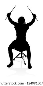 A drummer musician drumming drums in detailed silhouette