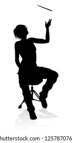 A drummer musician drumming drums in detailed silhouette