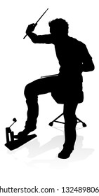 A drummer musician drumming drums in detailed silhouette