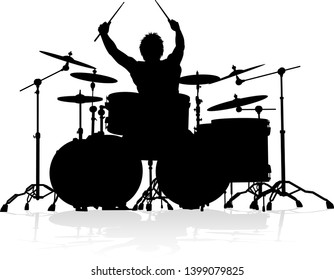 A drummer musician drumming drums in detailed silhouette